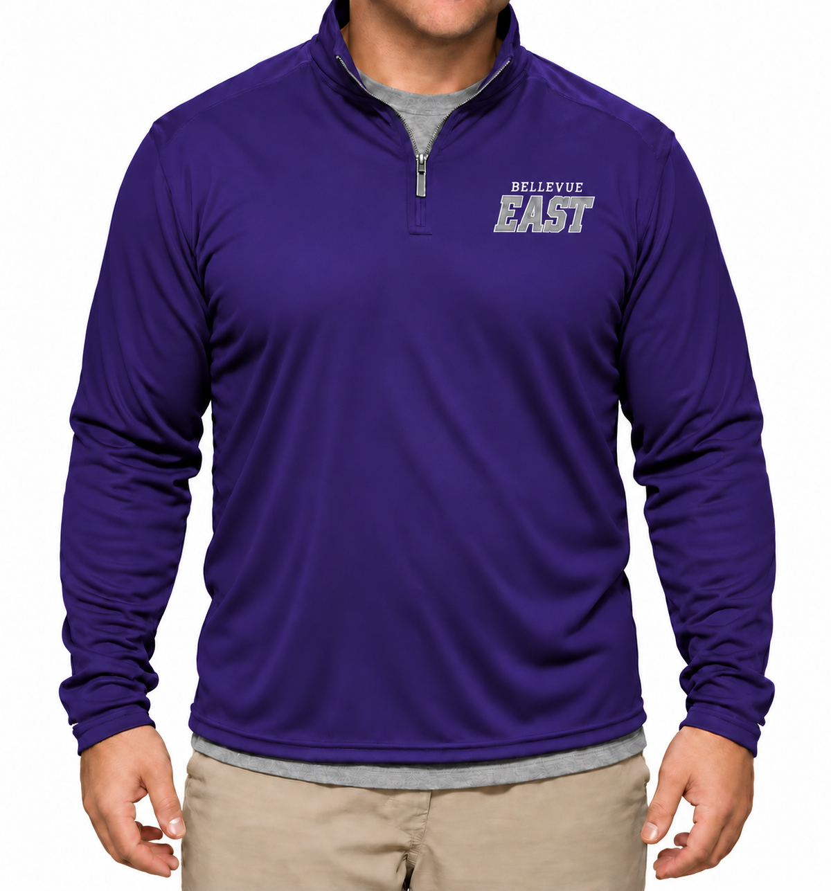 A man wearing a purple long-sleeve quarter-zip pullover with 'BELLEVUE EAST' printed in white on the left chest, paired with a gray undershirt and khaki pants, against a plain white background.