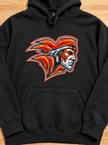 A black pullover hoodie laid flat on a light wood surface, featuring a large graphic of a Native American profile in red, orange, white, and black on the chest.